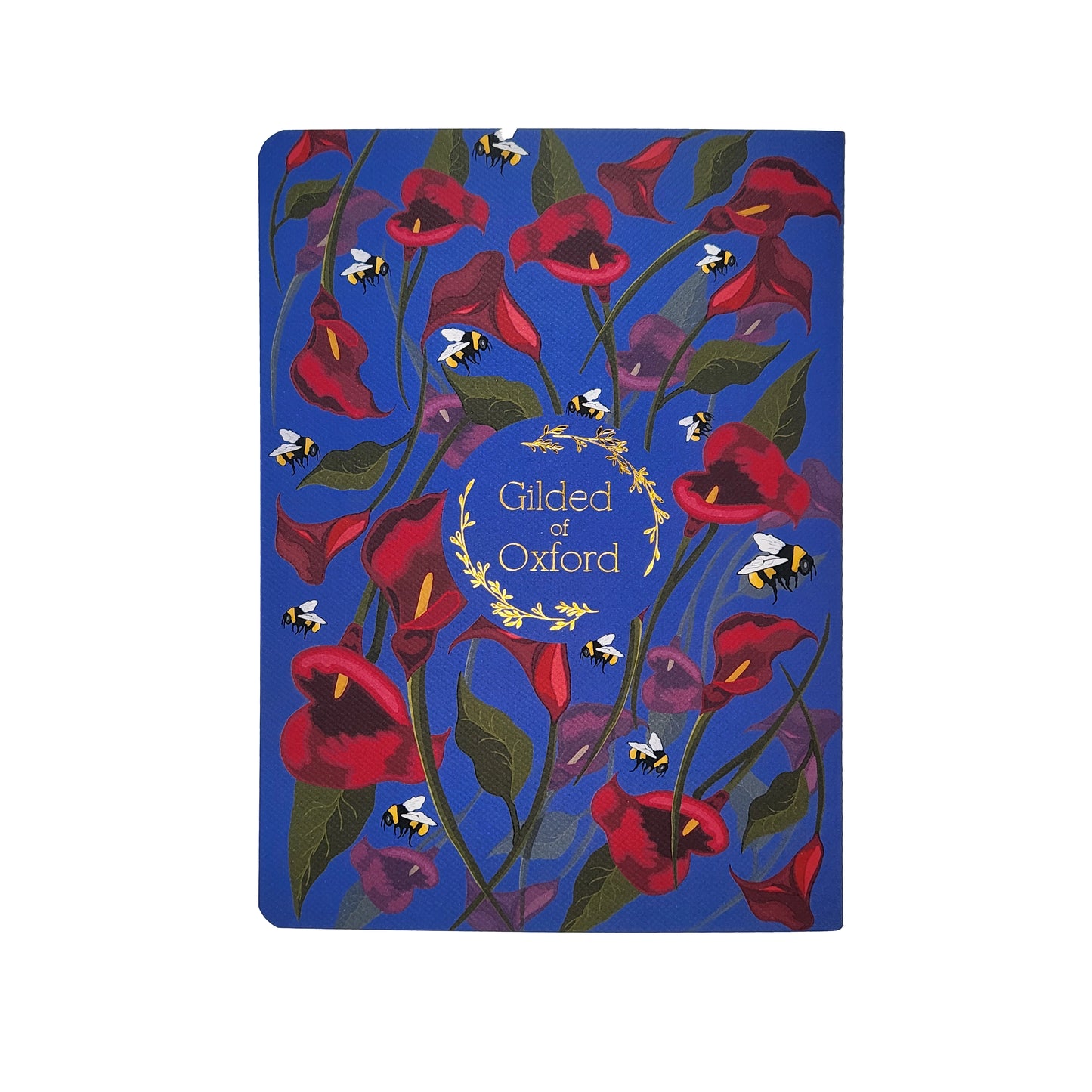 Floral soft cover notebook with 'Gilded of Oxford' gold foil branding on a indigo background