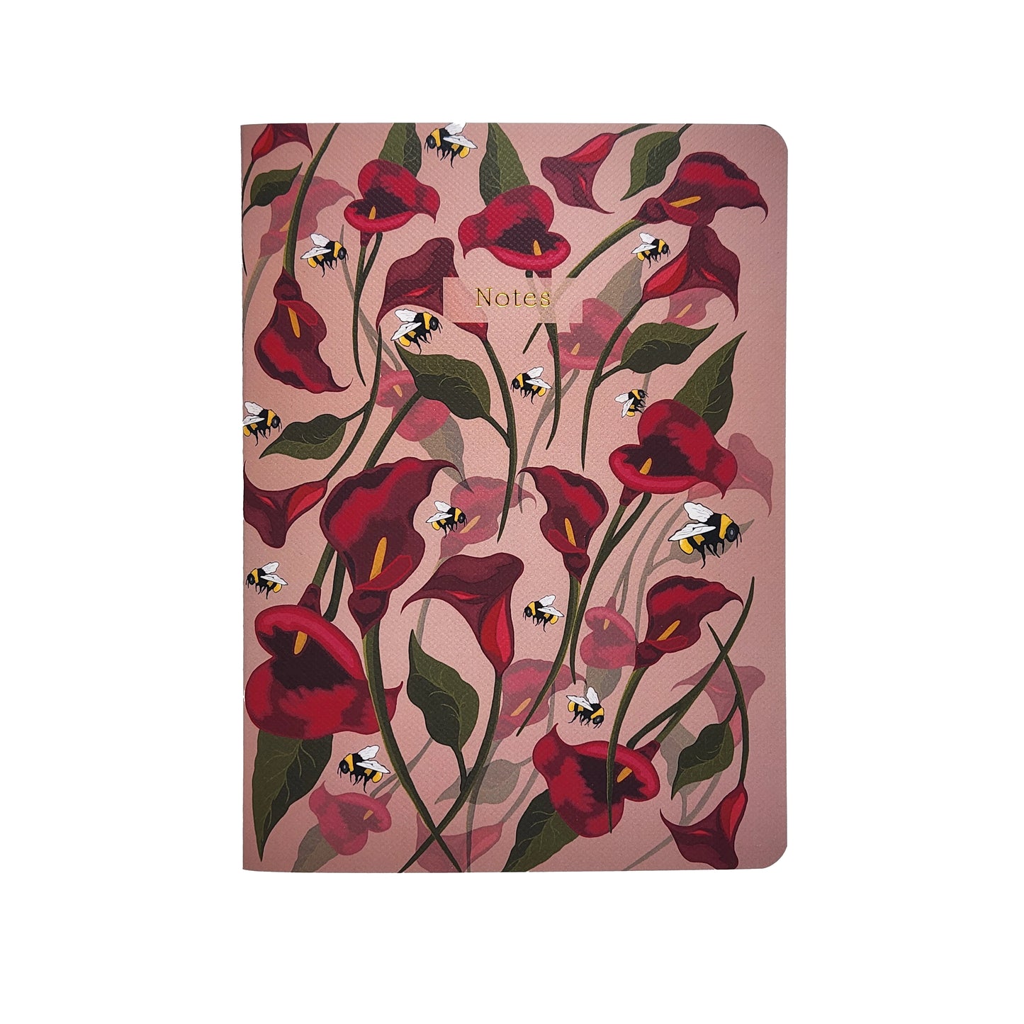Notebook with red floral design and bee illustrations on a pink background